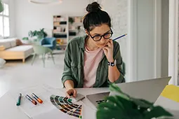Female student working on the laptop