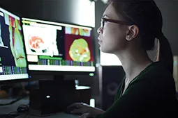 Female student working on the computer in the lab