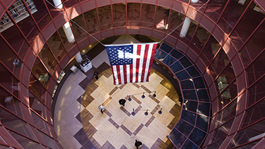 National flag of USA waving in the college auditorium