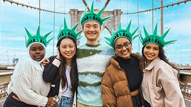 Group of students standing on the bridge